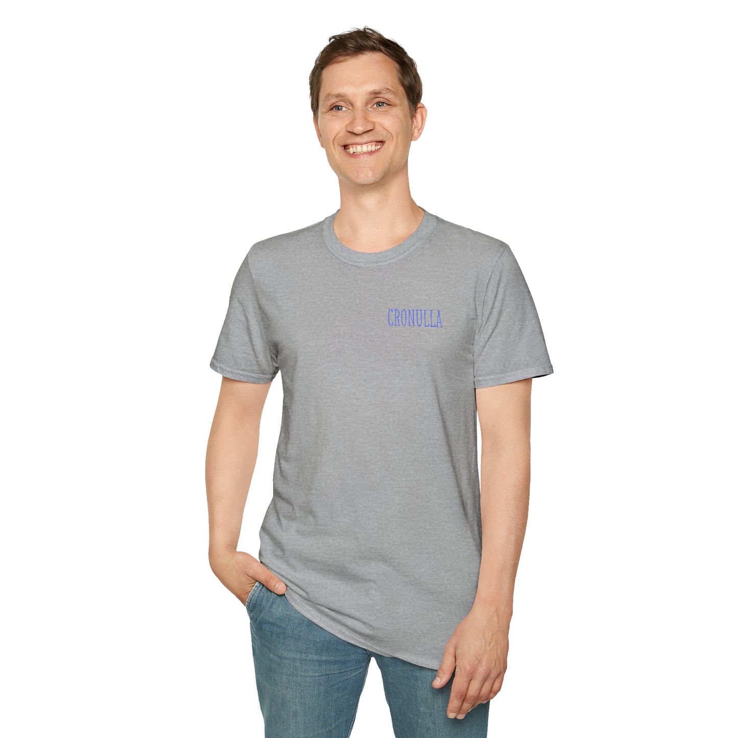 Standing male model wearing grey Cronulla Sunrise 'pocket design' photo t-shirt. Front of design features the word "Cronulla" in blue printed in the left front pocket area.