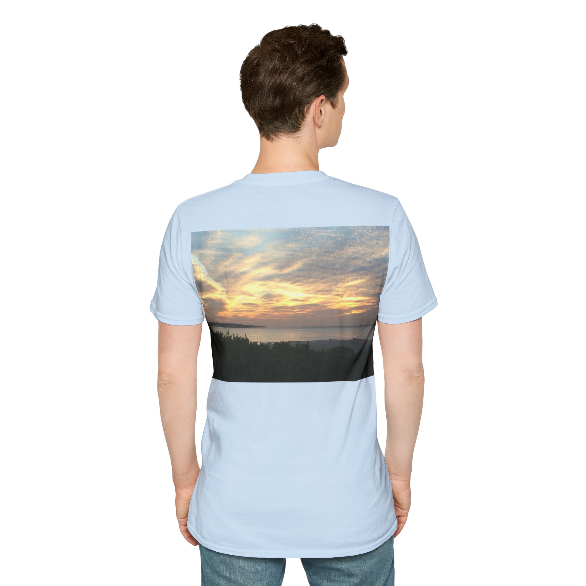 Standing male model wearing Cronulla Sunrise 'Pocket design' photo t shirt. Back of design features a photograph of the sun rising over Cronulla Beach through clouds. Pale blue t-shirt.